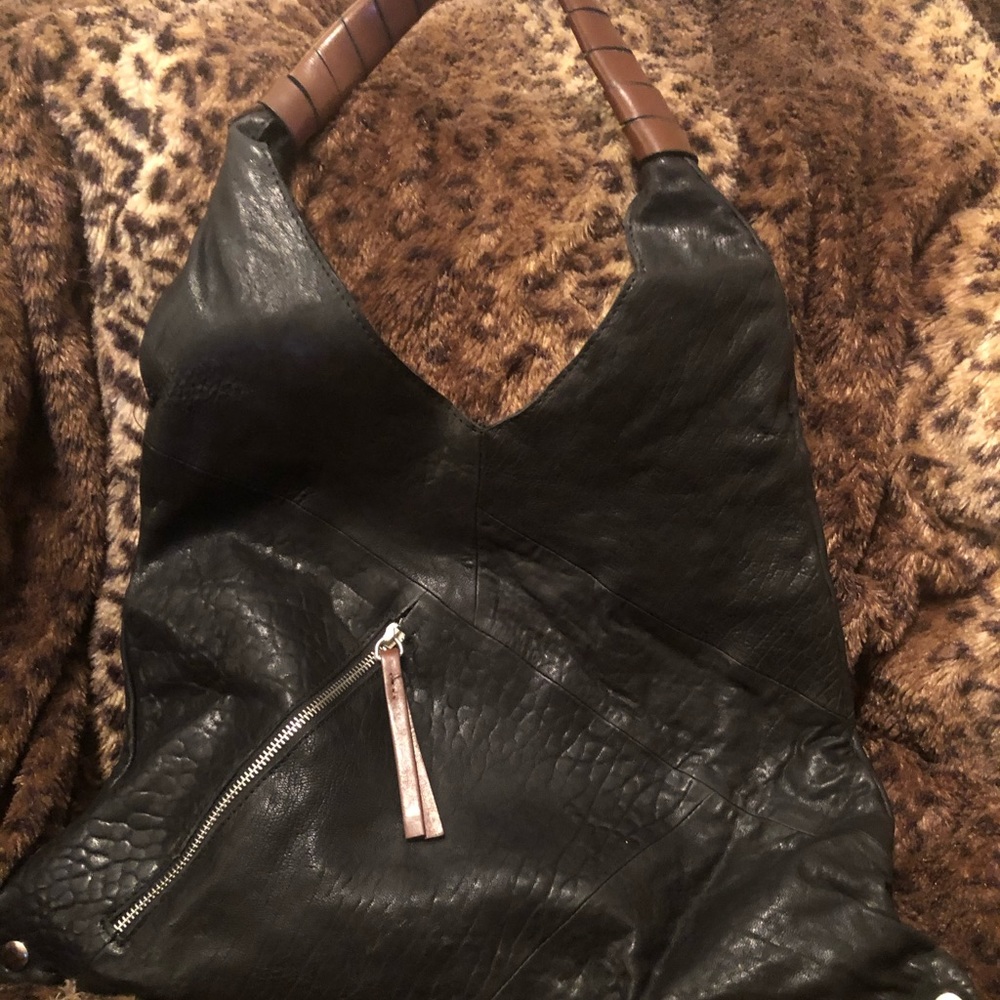 Maxon soft black leather shoulder bag with brown wrapped leather strap.